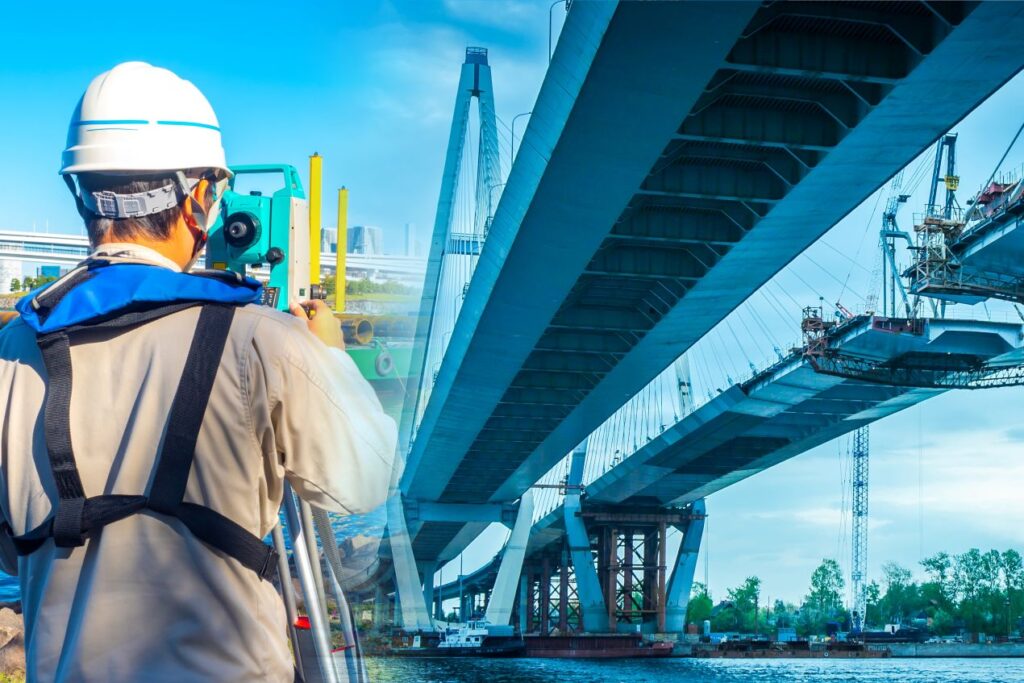 Ingenieur misst mit Vermessungstechnik die Neigung einer Bruecke – Anwendung von Neigungssensoren im Bauwesen